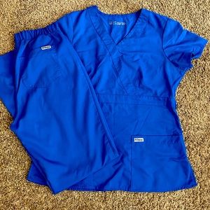 Royal blue Grey’s Anatomy scrubs.